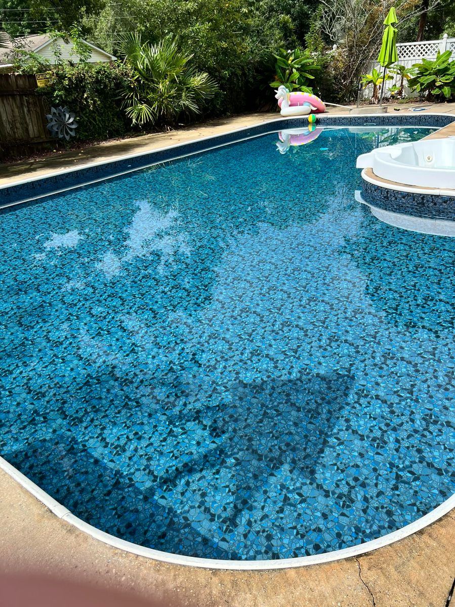 Renovated pool with pebble finish and new waterline tile