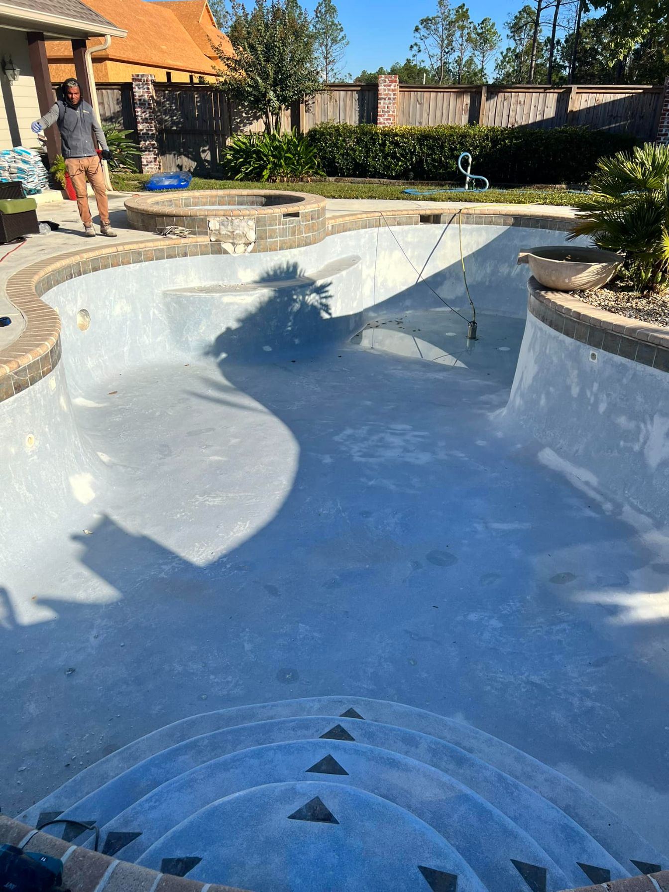 Drained gunite pool prepped for new plaster